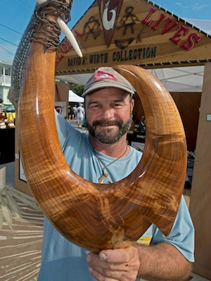 David Wirth, a marine and wildlife sculptor, displays his original style of art, bronze and wood  sculpture, such as his authentic circle hooks.